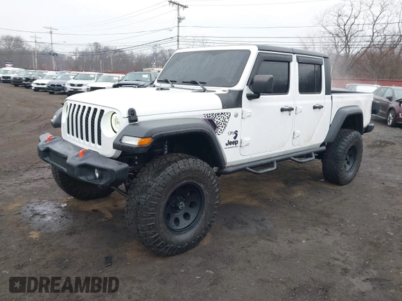 2020 Jeep Gladiator Sport S z VIN 1C6HJTAG0LL129461, wystawiony jako IAAI lot #41464713 z przebiegiem 66 625 mil mil oraz . Historia ofert i sprzedaży dostępna na DreamBid. Obrazek 2.