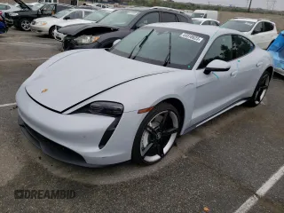 2021 Porsche Taycan 4S z VIN WP0AB2Y15MSA44483, wystawiony jako Copart lot #44510623 z przebiegiem 27 812 mil mil oraz . Historia ofert i sprzedaży dostępna na DreamBid. Obrazek 1.