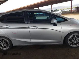 2015 Honda Fit LX with VIN 3HGGK5G52FM764205, listed as a IAAI auction lot 42641420 with 104,783 mi miles and . Bid and sale history available at DreamBid. Image 14.
