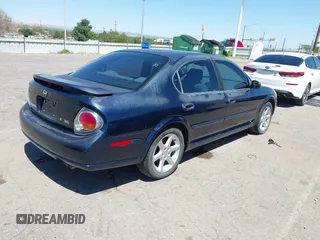 2002 Nissan Maxima GXE with VIN JN1DA31D92T408633, listed as a IAAI auction lot 42804201 with 199,403 mi miles and . Bid and sale history available at DreamBid. Image 4.