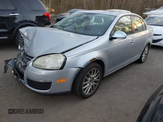 2009 Volkswagen Jetta Wolfsburg Edition with VIN 3VWRJ71K19M027857, listed as a IAAI auction lot 41312413 with 150,335 mi miles and . Bid and sale history available at DreamBid. Image 2.