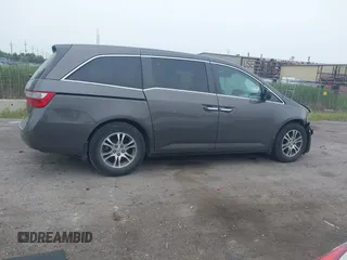 2011 Honda Odyssey EX-L with VIN 5FNRL5H64BB029087, listed as a IAAI auction lot 42508764 with 214,705 mi miles and . Bid and sale history available at DreamBid. Image 13.