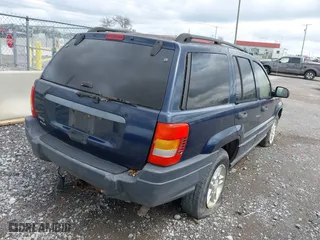 2003 Jeep Grand Cherokee Laredo with VIN 1J4GW48S63C591605, listed as a IAAI auction lot 41973681 with 177,024 mi miles. Bid and sale history available at carsss.com. Image 4.