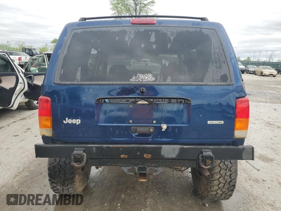 2000 Jeep Cherokee with VIN 1J4FF48S7YL209729, listed as a Copart auction lot 53647685 with 268,552 mi miles and Salvage title. Bid and sale history available at DreamBid. Image 6.