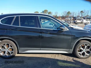2018 BMW X1 xDrive28i with VIN WBXHT3C36J5L29746, listed as a IAAI auction lot 41547100 with 103,420 mi miles and . Bid and sale history available at DreamBid. Image 13.