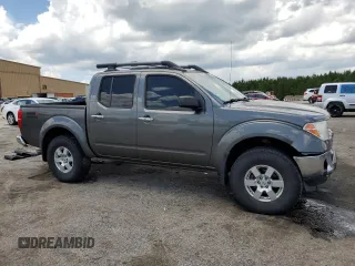 2008 Nissan Frontier SE with VIN 1N6AD07UX8C406795, listed as a Copart auction lot 61303185 with 145,742 mi miles and Salvage title. Bid and sale history available at DreamBid. Image 4.