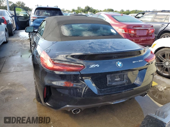 2020 BMW Z4 sDrive30i with VIN WBAHF3C06LWW75400, listed as a Copart auction lot 74297024 with 34,559 mi miles and Salvage Title. Bid and sale history available at carsss.com. Image 6.