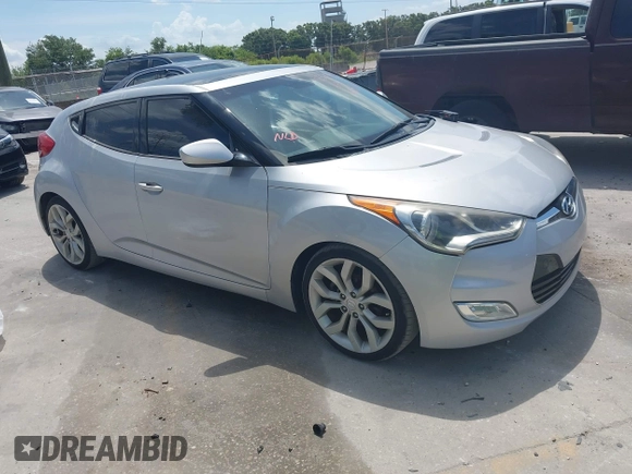 2012 Hyundai Veloster w/Gray Int with VIN KMHTC6ADXCU028115, listed as a IAAI auction lot 42361550 with 118,920 mi miles and . Bid and sale history available at DreamBid. Image 1.