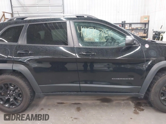 2019 Jeep Cherokee Trailhawk with VIN 1C4PJMBX9KD456748, listed as a IAAI auction lot 42367186 with 91,665 mi miles and . Bid and sale history available at DreamBid. Image 13.