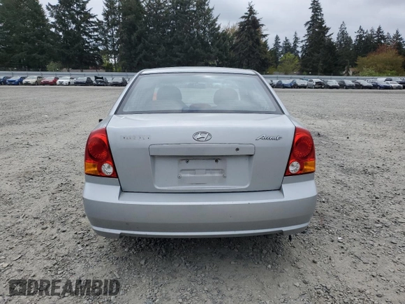 2005 Hyundai Accent GLS z VIN KMHCG45C75U639281, wystawiony jako Copart lot #54887095 z przebiegiem 136 090 mil mil oraz Szkoda całkowita • Salvage title. Historia ofert i sprzedaży dostępna na DreamBid. Obrazek 6.