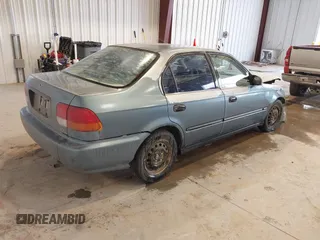 1998 Honda Civic DX with VIN JHMEJ6622WS000401, listed as a IAAI auction lot 41588057 with 296,638 mi miles. Bid and sale history available at carsss.com. Image 4.