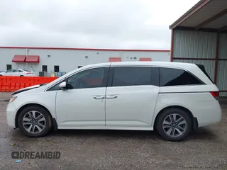 2014 Honda Odyssey Touring with VIN 5FNRL5H95EB059729, listed as a IAAI auction lot 42148110 with 135,304 mi miles and . Bid and sale history available at DreamBid. Image 15.