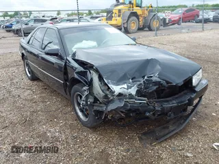 1994 Cadillac Seville STS z VIN 1G6KY5296RU823387, wystawiony jako IAAI lot #42151901 z przebiegiem 165 918 mil mil oraz . Historia ofert i sprzedaży dostępna na DreamBid. Obrazek 1.