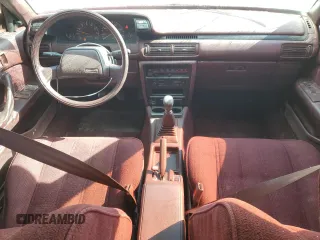 1989 Toyota Camry DLX z VIN 4T1SV21E3KU053153, wystawiony jako Copart lot #49917485 z przebiegiem 79 028 mil mil oraz Szkoda całkowita • Salvage title. Historia ofert i sprzedaży dostępna na DreamBid. Obrazek 8.