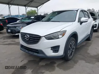 2016 Mazda CX-5 Grand Touring with VIN JM3KE4DY7G0737232, listed as a IAAI auction lot 42158279 with Not Provided miles and . Bid and sale history available at DreamBid. Image 2.