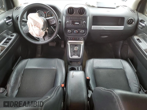 2014 Jeep Compass Latitude with VIN 1C4NJDEB4ED904731, listed as a Copart auction lot 51809165 with 104,760 mi miles and Salvage Title. Bid and sale history available at DreamBid. Image 8.
