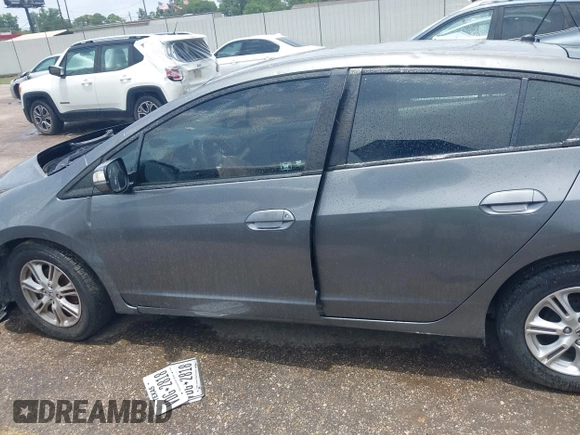 2010 Honda Insight EX z VIN JHMZE2H72AS023404, wystawiony jako IAAI lot #42505042 z przebiegiem Nie podano mil oraz . Historia ofert i sprzedaży dostępna na DreamBid. Obrazek 13.