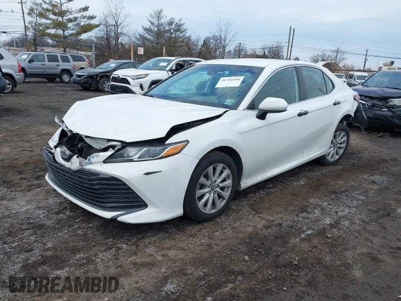 2020 Toyota Camry LE with VIN 4T1C11AK9LU912585, listed as a IAAI auction lot 41711816 with 142,751 mi miles. Bid and sale history available at carsss.com. Image 2.