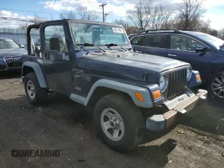 2000 Jeep Wrangler Sport with VIN 1J4FA49S2YP803165, listed as a Copart auction lot 85611904 with 192,427 mi miles and Non repairable. Bid and sale history available at DreamBid. Image 4.