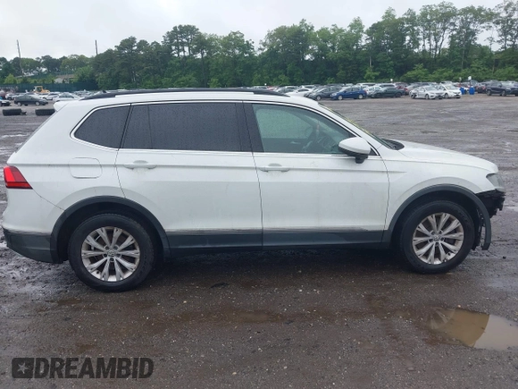 2018 Volkswagen Tiguan SEL with VIN 3VV2B7AX6JM059173, listed as a IAAI auction lot 42461175 with 86,679 mi miles and . Bid and sale history available at DreamBid. Image 13.