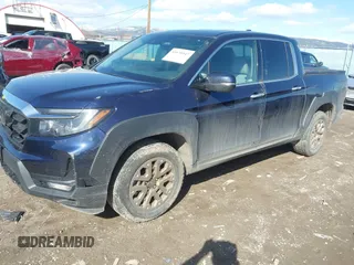 2022 Honda Ridgeline RTL-E with VIN 5FPYK3F71NB013522, listed as a IAAI auction lot 41670347 with 24,689 mi miles and . Bid and sale history available at DreamBid. Image 2.
