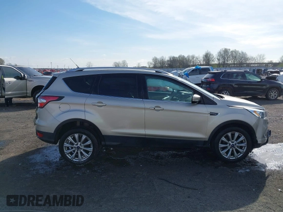 2017 Ford Escape Titanium with VIN 1FMCU0JD3HUB19602, listed as a IAAI auction lot 41816296 with 70,311 mi miles. Bid and sale history available at carsss.com. Image 13.