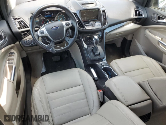 2014 Ford Escape Titanium with VIN 1FMCU9J91EUC90702, listed as a Copart auction lot 59116194 with 117,984 mi miles and Salvage Title. Bid and sale history available at DreamBid. Image 8.