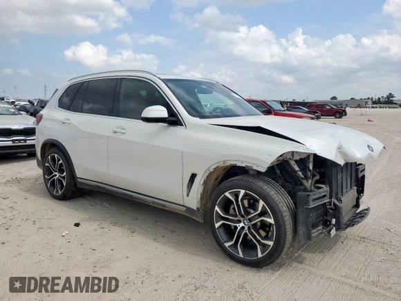 2021 BMW X5 sDrive40i with VIN 5UXCR4C06M9F56578, listed as a Copart auction lot 58218315 with 69,927 mi miles and Salvage title. Bid and sale history available at DreamBid. Image 4.