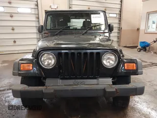2003 Jeep Wrangler Sport Right Hand Drive with VIN 1J4F449S63P359031, listed as a IAAI auction lot 41495087 with 126,678 mi miles. Bid and sale history available at carsss.com. Image 12.
