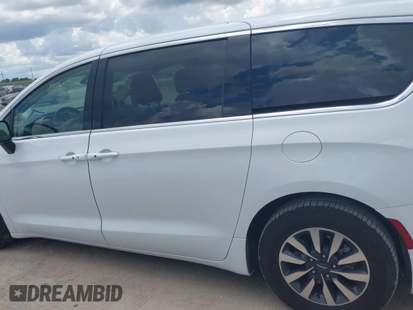 2023 Chrysler Pacifica Hybrid Touring L with VIN 2C4RC1L71PR622474, listed as a IAAI auction lot 42595061 with 55,880 mi miles and . Bid and sale history available at DreamBid. Image 14.