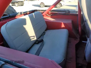 1991 Jeep Wrangler z VIN 2J4FY19P6MJ107521, wystawiony jako Copart lot #84077214 z przebiegiem 1 311 216 mil mil oraz Czysty tytuł • Clean title. Historia ofert i sprzedaży dostępna na DreamBid. Obrazek 10.