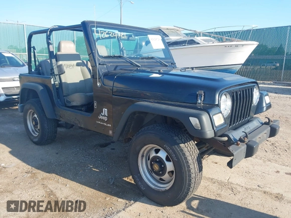 2004 Jeep Wrangler SE with VIN 1J4FA29144P797861, listed as a IAAI auction lot 42624721 with 156,867 mi miles and . Bid and sale history available at DreamBid. Image 1.