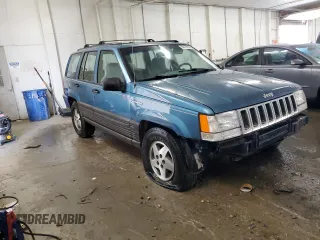 1994 Jeep Grand Cherokee Laredo with VIN 1J4FX58S0RC316030, listed as a Copart auction lot 66178754 with 281,785 mi miles and Salvage Title. Bid and sale history available at carsss.com. Image 4.
