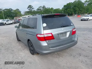 2005 Honda Odyssey TOURING with VIN 5FNRL38815B027811, listed as a IAAI auction lot 42105642 with 303,913 mi miles. Bid and sale history available at carsss.com. Image 3.