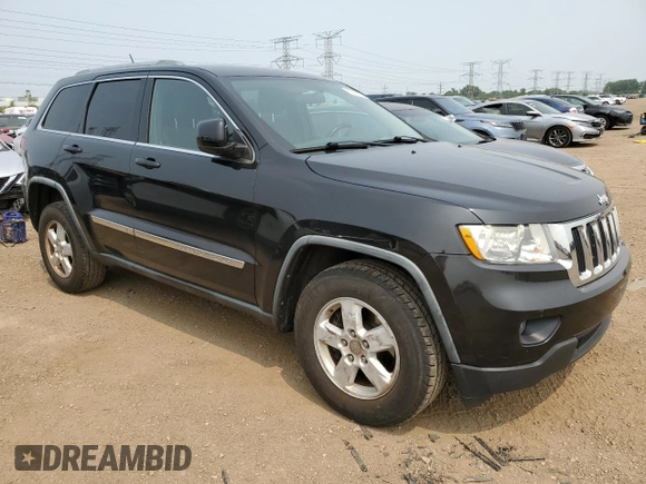 2011 Jeep Grand Cherokee Laredo with VIN 1J4RR4GGXBC567450, listed as a Copart auction lot 60056085 with 165,077 mi miles and Salvage title. Bid and sale history available at DreamBid. Image 4.