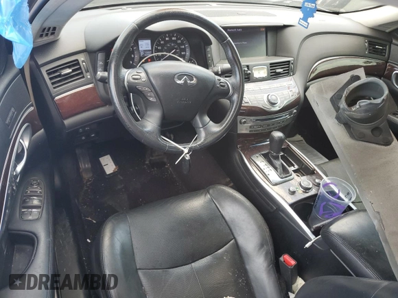 2013 Infiniti M with VIN JN1BY1AR2DM601965, listed as a Copart auction lot 62014215 with 134,047 mi miles and Salvage title. Bid and sale history available at DreamBid. Image 8.
