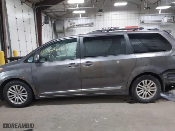 2012 Toyota Sienna XLE AAS with VIN 5TDYK3DC9CS268758, listed as a IAAI auction lot 41613513 with 214,601 mi miles. Bid and sale history available at carsss.com. Image 14.