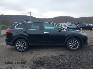 2015 Mazda CX-9 Grand Touring z VIN JM3TB3DV6F0464926, wystawiony jako IAAI lot #42035670 z przebiegiem 168 257 mil mil oraz . Historia ofert i sprzedaży dostępna na DreamBid. Obrazek 13.