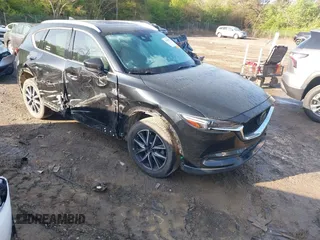 2018 Mazda CX-5 Grand Touring z VIN JM3KFBDM7J0320764, wystawiony jako IAAI lot #41910996 z przebiegiem 128 719 mil mil oraz . Historia ofert i sprzedaży dostępna na DreamBid. Obrazek 1.