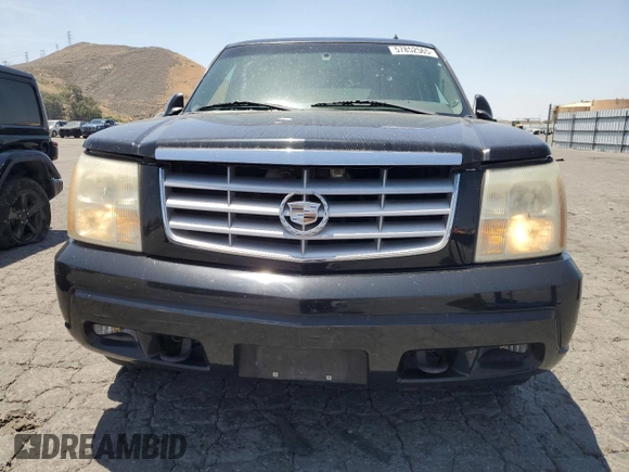 2002 Cadillac Escalade z VIN 1GYEC63T42R189976, wystawiony jako Copart lot #57852565 z przebiegiem 243 089 mil mil oraz Szkody całkowita. Historia ofert i sprzedaży dostępna na DreamBid. Obrazek 5.