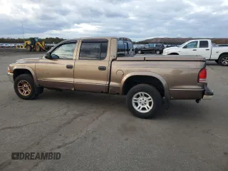 2001 Dodge Dakota z VIN 1B7GG2AX11S108005, wystawiony jako Copart lot #87124934 z przebiegiem 248 482 mil mil oraz Czysty tytuł • Clean title. Historia ofert i sprzedaży dostępna na DreamBid. Obrazek 2.