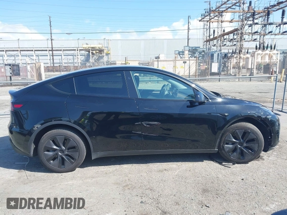 2025 Tesla Model Y Long Range with VIN 7SAYGDEE9SF278607, listed as a IAAI auction lot 41932084 with 9,667 mi miles and . Bid and sale history available at carsss.com. Image 14.