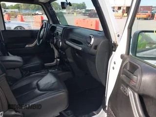 2016 Jeep Wrangler Unlimited Sahara z VIN 1C4HJWEG5GL172350, wystawiony jako IAAI lot #39987533 z przebiegiem 158 540 mil mil oraz . Historia ofert i sprzedaży dostępna na DreamBid. Obrazek 5.