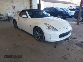 2015 Nissan 370Z Touring z VIN JN1AZ4FH9FM430581, wystawiony jako IAAI lot #41256922 z przebiegiem 40 699 mil mil oraz . Historia ofert i sprzedaży dostępna na DreamBid. Obrazek 1.