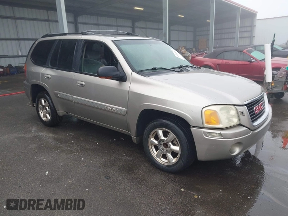 2002 GMC Envoy SLT with VIN 1GKDS13S322491528, listed as a IAAI auction lot 41482996 with 251,182 mi miles. Bid and sale history available at carsss.com. Image 1.