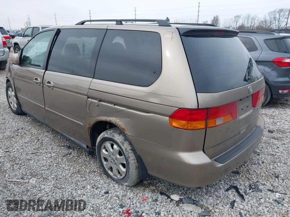 2004 Honda Odyssey EX z VIN 5FNRL18634B004127, wystawiony jako IAAI lot #41854878 z przebiegiem 242 601 mil mil oraz . Historia ofert i sprzedaży dostępna na DreamBid. Obrazek 3.