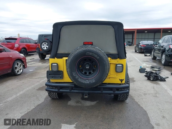 2000 Jeep Wrangler SE with VIN 1J4FA29P2YP797156, listed as a IAAI auction lot 41517183 with 114,236 mi miles. Bid and sale history available at carsss.com. Image 16.