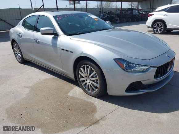2014 Maserati Ghibli S Q4 with VIN ZAM57RTA8E1085631, listed as a IAAI auction lot 41829745 with 80,418 mi miles. Bid and sale history available at carsss.com. Image 1.