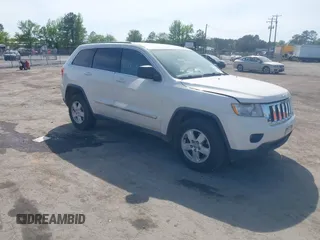 2012 Jeep Grand Cherokee Laredo with VIN 1C4RJFAG2CC176313, listed as a IAAI auction lot 42098127 with 162,556 mi miles. Bid and sale history available at carsss.com. Image 1.