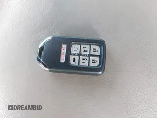 2021 Honda Odyssey Touring with VIN 5FNRL6H80MB010952, listed as a IAAI auction lot 42080412 with 90,594 mi miles and . Bid and sale history available at DreamBid. Image 11.